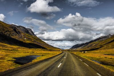 Road amidst landscape against sky