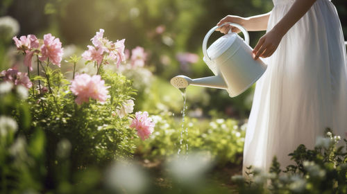 Rear view of woman holding flowers