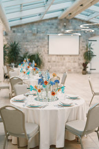 Empty chairs and tables in restaurant