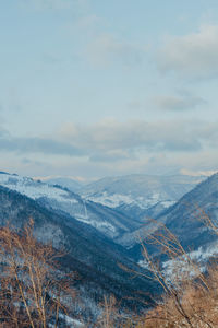 Scenic view of snowcapped mountains against sky