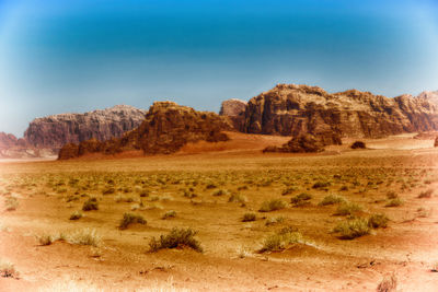 Scenic view of desert landscape against sky