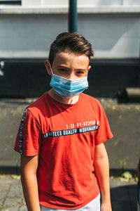 Portrait of boy standing outdoors