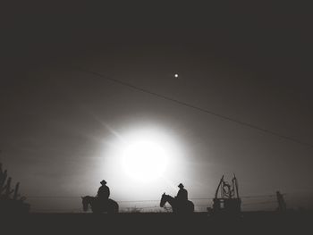 Silhouette of people at sunset