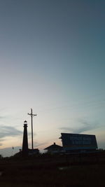 Low angle view of silhouette building against sky during sunset