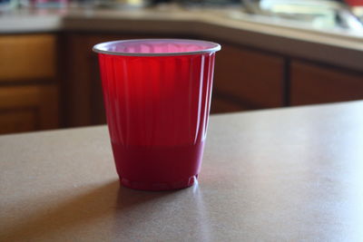 Close-up of red drink on table