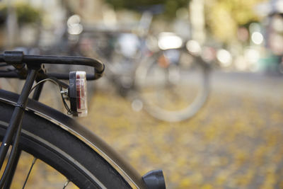 Close-up of bicycle on street