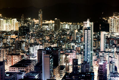 High angle view of illuminated buildings in city at night