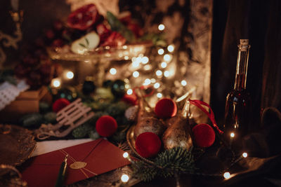 Christmas academia vintage harry potter table - fir, candles, wine, red decor, glasses, gingerbread