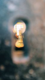 Illuminated lamp post at night