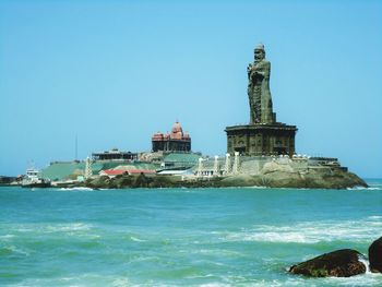 Scenic view of sea against clear blue sky