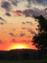 Scenic view of silhouette landscape against romantic sky at sunset