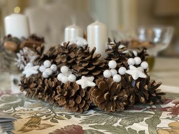 Close-up of pine cone on table at home