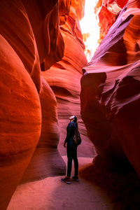 Rear view of man standing on rock