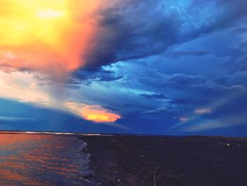 Scenic view of dramatic sky over sea