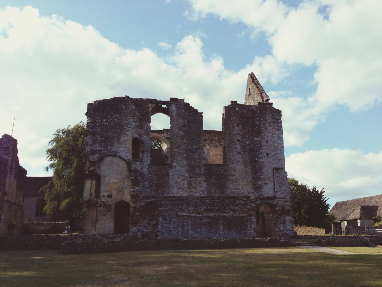 architecture, building exterior, built structure, sky, cloud - sky, history, old, low angle view, the past, cloud, old ruin, abandoned, religion, tree, cloudy, church, weathered, castle, damaged, outdoors