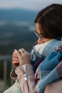 Close-up of woman wearing warm clothing while standing outdoors