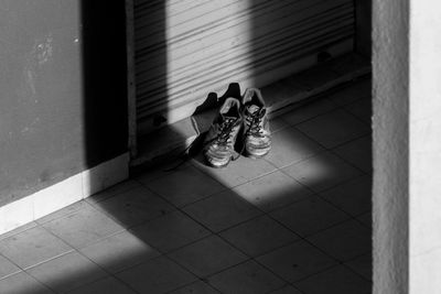 High angle view of shoes on tiled floor