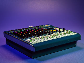3d rendering of vintage audio mixer over violet background