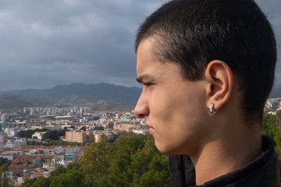 Portrait of young man looking away