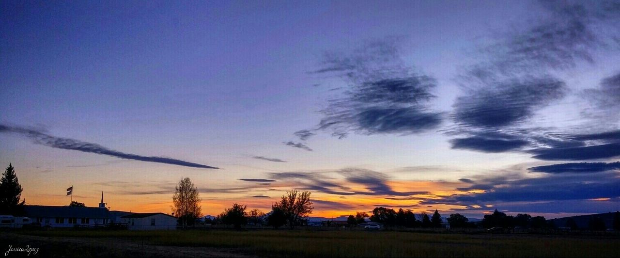 sunset, silhouette, sky, building exterior, built structure, architecture, scenics, beauty in nature, house, landscape, tranquil scene, dusk, blue, cloud - sky, tree, tranquility, nature, orange color, cloud, field