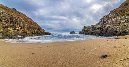 Scenic view of beach against sky