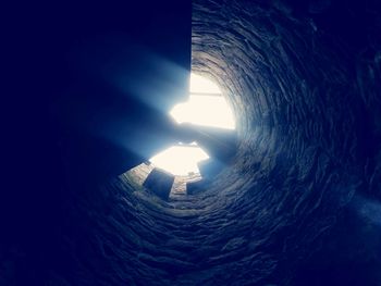 Low angle view of illuminated tunnel