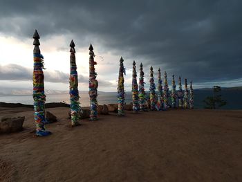 Multi colored umbrellas on beach against sky