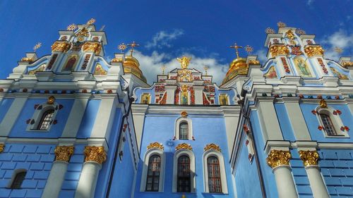 Low angle view of church against blue sky