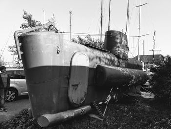 Abandoned boat moored against clear sky