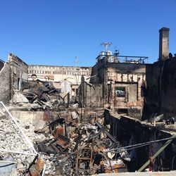 Abandoned building against clear blue sky