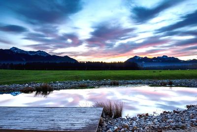 Scenic view of landscape against cloudy sky