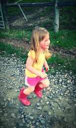 Girl smiling while standing on grass