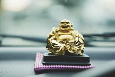 Close-up of figurine in car