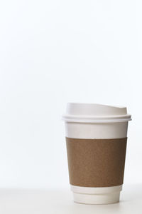 Close-up of coffee cup against white background