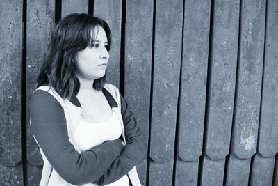 Close-up portrait of young woman standing outdoors