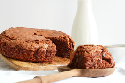 Close-up of cake on table against white background