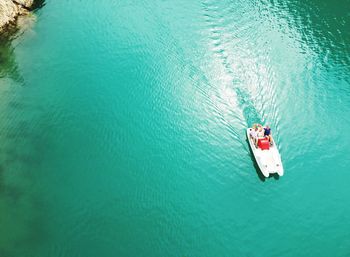 Aerial view of people sailing in sea