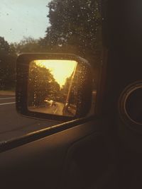 Reflection of car on side-view mirror