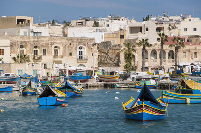 Boats moored at harbor