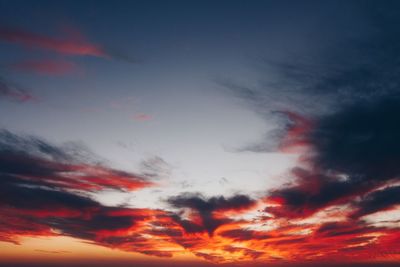 Low angle view of dramatic sky during sunset