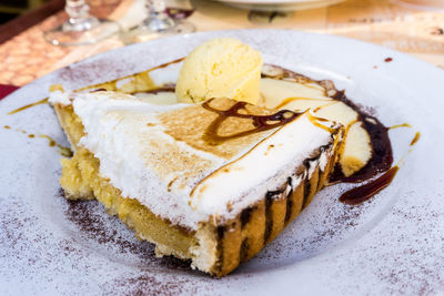 Directly above shot of dessert with ice cream served in plate on table