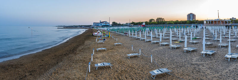 Sunset and twilight on the beach of lignano pineta. italy