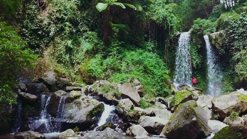 Scenic view of river flowing through rocks