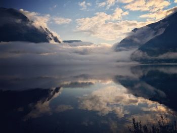 Scenic view of lake against sky during sunset