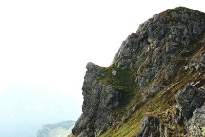Close-up of rock against sky