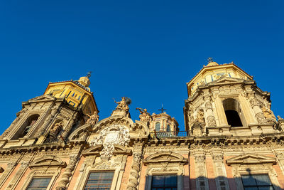 Low angle view of temple building against blue sky