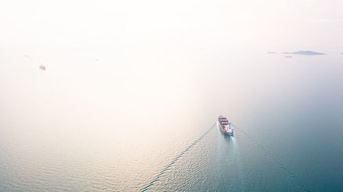 High angle view of ship sailing on sea against sky