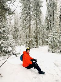 Man skiing on snow covered field