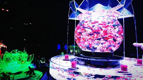 Close-up of illuminated lighting equipment on glass table