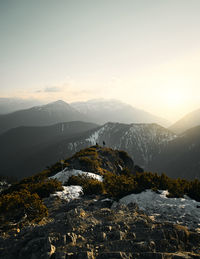 Scenic view of mountains against sky during sunset